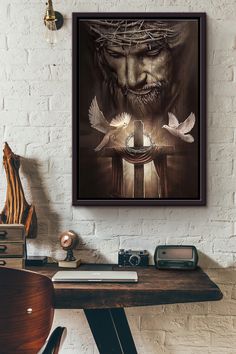 a wall hanging above a desk with a painting on it and two birds flying around