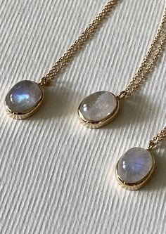 Sorcerer's Pendant - 14k yellow gold necklace with 8mm x 6mm oval rainbow moonstone, classic bezel setting, and 16" cable chain. Made from recycled materials. Dainty 14k Gold Oval Cabochon Jewelry, Dainty Oval Jewelry With Cable Chain, Dainty Oval Cable Chain Jewelry, Minimalist 14k Gold Oval Cabochon Jewelry, Everyday 14k Gold Oval Cabochon Jewelry, Everyday 14k Gold Jewelry With Oval Cabochon, Everyday Oval Bezel Set Jewelry, Oval Moonstone Jewelry For Everyday, Oval Cabochon Jewelry With Smooth Bezel For Gift