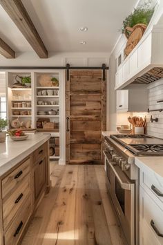 a kitchen with wooden floors and white cabinets