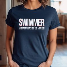 a woman wearing a t - shirt that says, swimmer aquatic master of motion