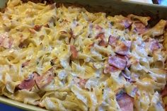 a casserole dish with ham and cheese in it