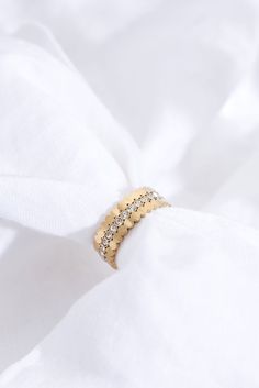 Meet our Triple Stacking Gold Ring Set – three individual rings that come together as a set. Wear them alone or let them perfectly fit together.   Each ring is real 18k gold-plated and features scalloped edges. One of the three rings features sparkly cubic zirconia stones.  Waterproof, sweat-proof and life proof! All our jewellery is made of the highest quality recycled materials and are free from nickel and brass, so won't ever tarnish, rust or turn your skin green!  All Ballinger pieces are ma Elegant 14k Gold Jewelry With Fluted Bezel, Fine Jewelry With Fluted Bezel In 14k Gold, Gold Jewelry With Fluted Bezel For Gift, Gold Promise Ring With Fluted Bezel, Elegant Wedding Jewelry With Fluted Bezel, Elegant Wedding Watch With Fluted Bezel, 14k Gold Jewelry With Fluted Bezel For Gift, Gold Rings With Fluted Bezel For Wedding, Elegant Yellow Gold Jewelry With Fluted Bezel