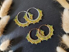 Elegant handwoven hoops with fire-polished Czech beads and Miyuki Delica Option 1 : Green/yellow & brass Option 2 : Green/yellow & sterling silver These beaded hoop earrings were designed to match the Coburn bracelets - both the hoop earrings and the bracelet are available as a jewelry set in my shop. I used a number of high-quality seed beads and fire-polished glass beads of well-known glass bead manufacturers for this design. The filled herringbone stitch was woven with resilien beading thread Handmade Adjustable Green Hoop Earrings, Adjustable Handmade Green Hoop Earrings, Handmade Green Hoop Earrings For Gift, Yellow Tiny Beads Festival Jewelry, Yellow Tiny Beads Jewelry For Festival, Gold Small Hoop Beaded Earrings For Festival, Traditional Handmade Green Hoop Earrings, Artisan Handmade Small Hoop Earrings, Handmade Green Beaded Hoop Earrings