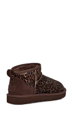 An ultrashort shaft adds a twist to this abbreviated version of a classic UGG boot—this time in cheetah-print genuine calf hair. The style delivers extra comfort with a lining from UGGplush, a moisture-wicking textile made from a wool-rich blend but crafted to feel and wear like genuine shearling. 1 3/4" heel; 1" platform (size 11) 4" shaft Pull-on style Genuine calf-hair (Vietnam) and leather upper/UGGplush wool-blend lining/synthetic sole Imported Cheetah Print Uggs, Cute Vans, Classic Ugg Boots, Cute Online Clothing Stores, Pretty Shoes Sneakers, Shoes Outfit Fashion, Shoe Inspo