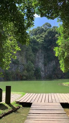 a wooden dock sitting next to a body of water