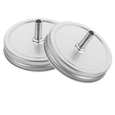 two round metal plates with screws on each one and the other side is shown