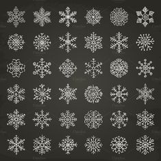 a collection of snowflakes on a chalkboard background, all drawn in white