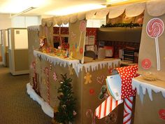 an office decorated for christmas with candy and candies