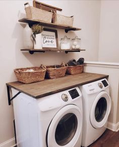 a washer and dryer sitting next to each other on top of a wooden counter