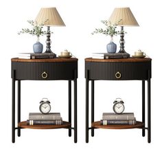 pair of nightstands with clock and flowers on each side, one is turned off