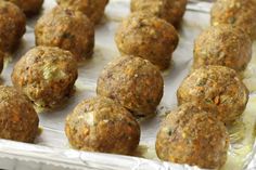 some meatballs are sitting in a pan and ready to be cooked on the grill