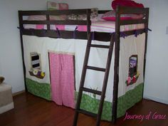 a bunk bed with a ladder to the top and pink curtains on the bottom, in a child's bedroom