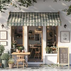 the outside of a cafe with tables and chairs