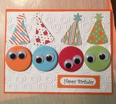 a birthday card with three buttons on it