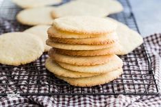 a stack of cookies sitting on top of a cooling rack