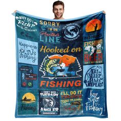 a man is holding up a blue blanket with fishing related items and words on it