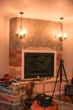 a living room filled with furniture and a fire place next to a wall mounted tv