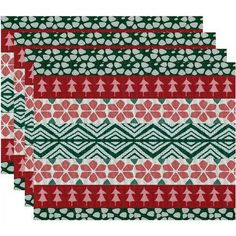 four red and green placemats with christmas trees on them