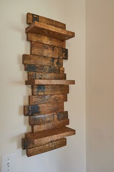 a wooden shelf hanging on the wall