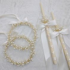 three wedding garters with ribbons and pearls