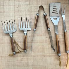 five different types of kitchen utensils laid out on a table