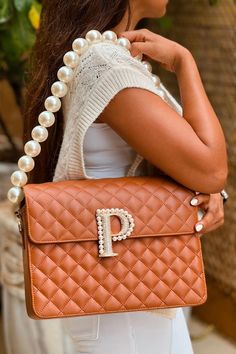 Tan geometric quilted bag with custom initial embellished with Swarovski and pearls and detachable pearl strap. - Aza Fashions Luxury Tote Shoulder Bag With Pearl Handle, Luxury Crossbody Shoulder Bag With Pearl Handle, Luxury Tote Bag With Pearl Handle, Luxury Shoulder Bag With Pearl Handle, Luxury Shoulder Bag With Pearl Handle For Everyday, Luxury Pearl Embellished Clutch Bag, Luxury Pearl Handle Shoulder Bag, Luxury Clutch Shoulder Bag With Pearl Handle, Luxury Pearl Embellished Clutch Shoulder Bag