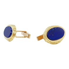 A fine pair of English Modernist cufflinks.  By Kutchinsky, the renowned London jewelry house.  In 18k gold and set with flat oval lapis cabochons.  Marked for 1970, a period in which Joseph Kutchinsky was at the height of his design influence.  These Modernist cufflinks have a wonderful tapered edge with hand tooling that obviously borrows design elements from Andrew Grima's work.  Fully hallmarked.  Simply wonderful high-level English Mid-Century Modern cufflinks!  Date: Mid-20th Century, 1970 Oval Polished Cufflinks For Business, Elegant Yellow Gold Oval Cufflinks, Luxury Oval Cufflinks For Formal Occasions, Classic Yellow Gold Oval Cufflinks, Classic Oval Yellow Gold Cufflinks, Luxury Oval Cufflinks As Gift, Oval Yellow Gold Cufflinks For Gift, Oval Gold Jewelry For Business, Oval Yellow Gold Jewelry For Business