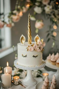 a white cake with gold and pink decorations