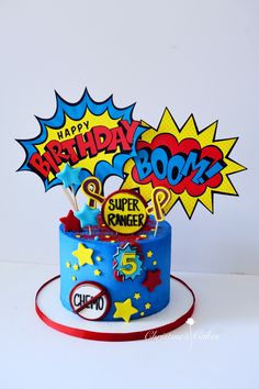 a birthday cake decorated with comic characters