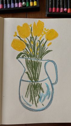 a drawing of yellow flowers in a blue vase with crayons next to it