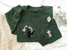 This sweatshirt is made of high quality cotton weave, advanced embroidery technology to ensure bright colors and detailed patterns, unisex and soft and comfortable. Sweatshirt makes for an edgy, casual style. Each sweatshirt has a unique aesthetic, and is a gift that will not go out of style for your own family, friends, or teachers. Size We offer a variety of colors and different sizes, you can choose your favorite and size, we recommend that you use the size of the potential better fit or loos Cat Design Cotton Long Sleeve Sweatshirt, Cotton Crew Neck Sweater With Cat Design, Casual Cotton Sweatshirt With Cat Design, Cotton Crew Neck Sweatshirt With Cat Design, Green Embroidered Crew Neck Hoodie, Casual Green Sweatshirt With Embroidery, Green Long Sleeve Sweatshirt With Machine Embroidery, Green Crew Neck Sweatshirt With Machine Embroidery, Green Crew Neck Sweatshirt With Embroidery