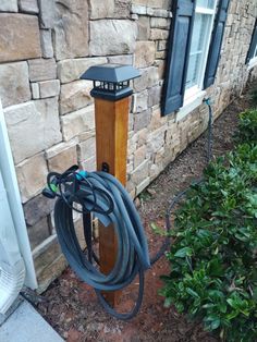 a garden hose is attached to the side of a house