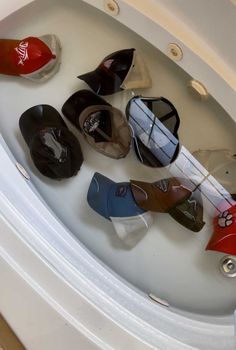 there are many pairs of shoes in the sink