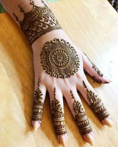 hendi tattoos on the hand of a woman