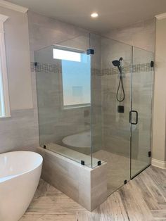 a bathroom with a large tub and walk in shower