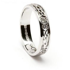 a wedding ring with an engraved design on it