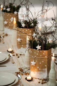 an image of a table setting with candles and christmas decorations on the table in front of it