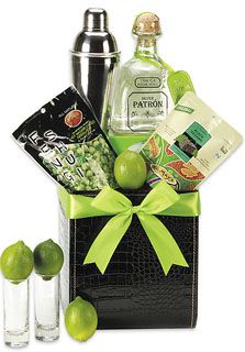 a gift basket with limes, vodka bottles and candies for someone to share