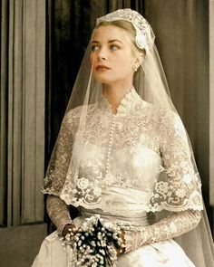 an old photo of a woman wearing a wedding dress