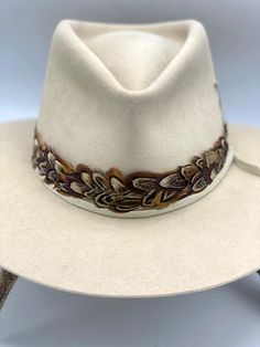 Spoor – JW Bennett Western Cream Hat Bands For Kentucky Derby, Vintage Beige Hat Bands For Country Events, Custom Feather Hat Bands For Country Events, Western Beige Hat Bands With Flat Crown, Handmade Western Cream Hat Band, Cream Handmade Western Hat Bands, Handmade Cream Western Hat Bands, Adjustable Custom Fur Felt Hat Bands, Handmade Western Beige Hat Bands