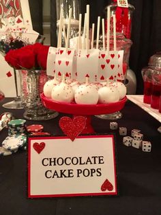 a table topped with lots of cake pops