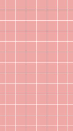 a pink tiled wall with white squares on it