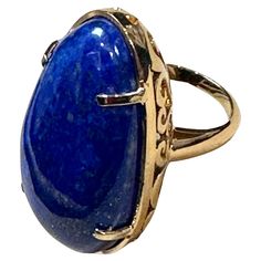 Vintage Beautiful Filigree Ring in 14 Karat yellow gold This is a ring which has a 63 carat of high quality natural Lapis Lazuli Cabochon , Vintage ring with beautiful filigree work around it Color , Cut and clarity is very nice. 14 K Yellow gold 25 grams with stone Ring Size 6.5 but can be resized to any size. Beautiful vintage filigree work on the side of the ring and on the band . Please look at all the pictures FOLLOW MonalisaJewelry Inc. storefront to view the latest collection. We encourag Vintage Cocktail Ring, Lapis Lazuli Ring, Filigree Ring, Vintage Ring, Ring Vintage, Stone Ring, Cocktail Rings, Lapis Lazuli, Stone Rings