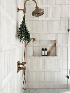 White vertical shower tiles with brass shower head and marblw accents by Laura Design and Co, Dallas interior designer Shoji White, Amazing Showers, Casa Country, Upstairs Bathrooms, Bathroom Redo