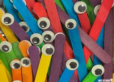 many different colored toothbrushes with eyes on them