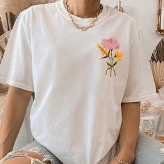 Watercolor Flower T Shirt. White Short Sleeve Tee. Custom Handmade To Order. For An Oversized Graphic Tee Please Size Up! Thank You For Considering To Purchase From A Female Small Business Owner! White Crew Neck Tops With Plant Print, White Crew Neck T-shirt With Floral Applique, White Short Sleeve Top With Floral Applique, White Floral Embroidered T-shirt For Spring, White Crew Neck T-shirt With Floral Print, White Floral Print T-shirt Crew Neck, White Floral Print Crew Neck Top, White Floral Print Crew Neck T-shirt, White Floral Applique Short Sleeve Top