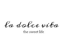 the words la dolce vita are written in black ink