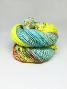 two skeins of yarn sitting on top of each other