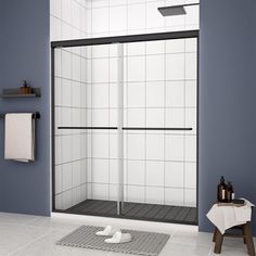 a bathroom with blue walls and tile flooring, including a walk in shower stall