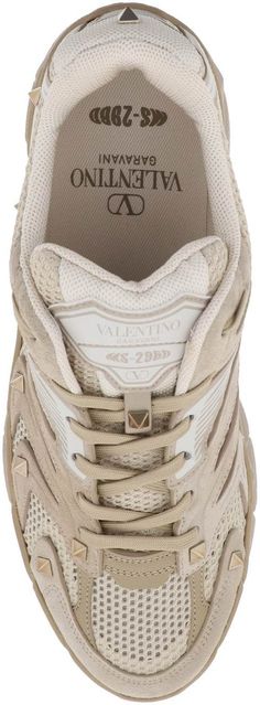 Step up your sneaker game with these fashion-forward MS-2960 sneakers. Made with a combination of beige mesh and suede, these kicks are not only stylish but also durable. The studded detailing adds an edgy touch, while the lace-up closure ensures a secure fit. Plus, with the logo on the tongue and a rubber sole, you'll be walking in comfort and style all day long. Whether you're running errands or hanging out with friends, these Italian-sized sneakers will elevate any casual look. Beige mesh and Look Beige, Fit Logo, Valentino Garavani, Step Up, Walking, Lace Up, Mesh, Running, Sneakers